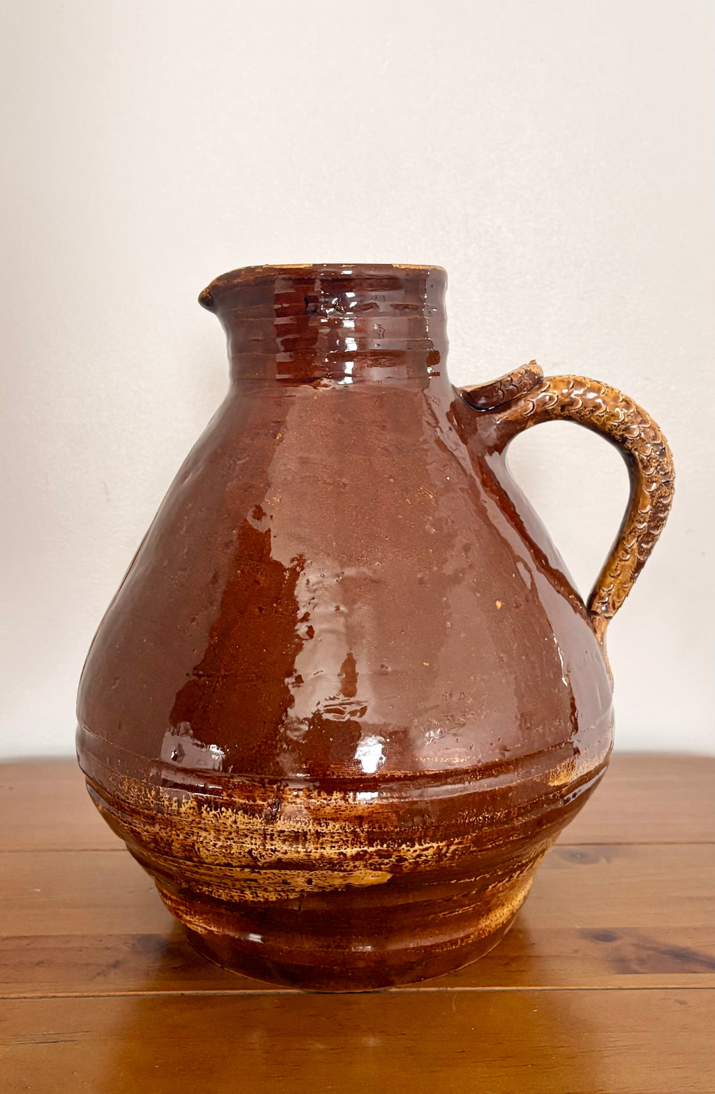 Large earthenware jug with a serpent handle