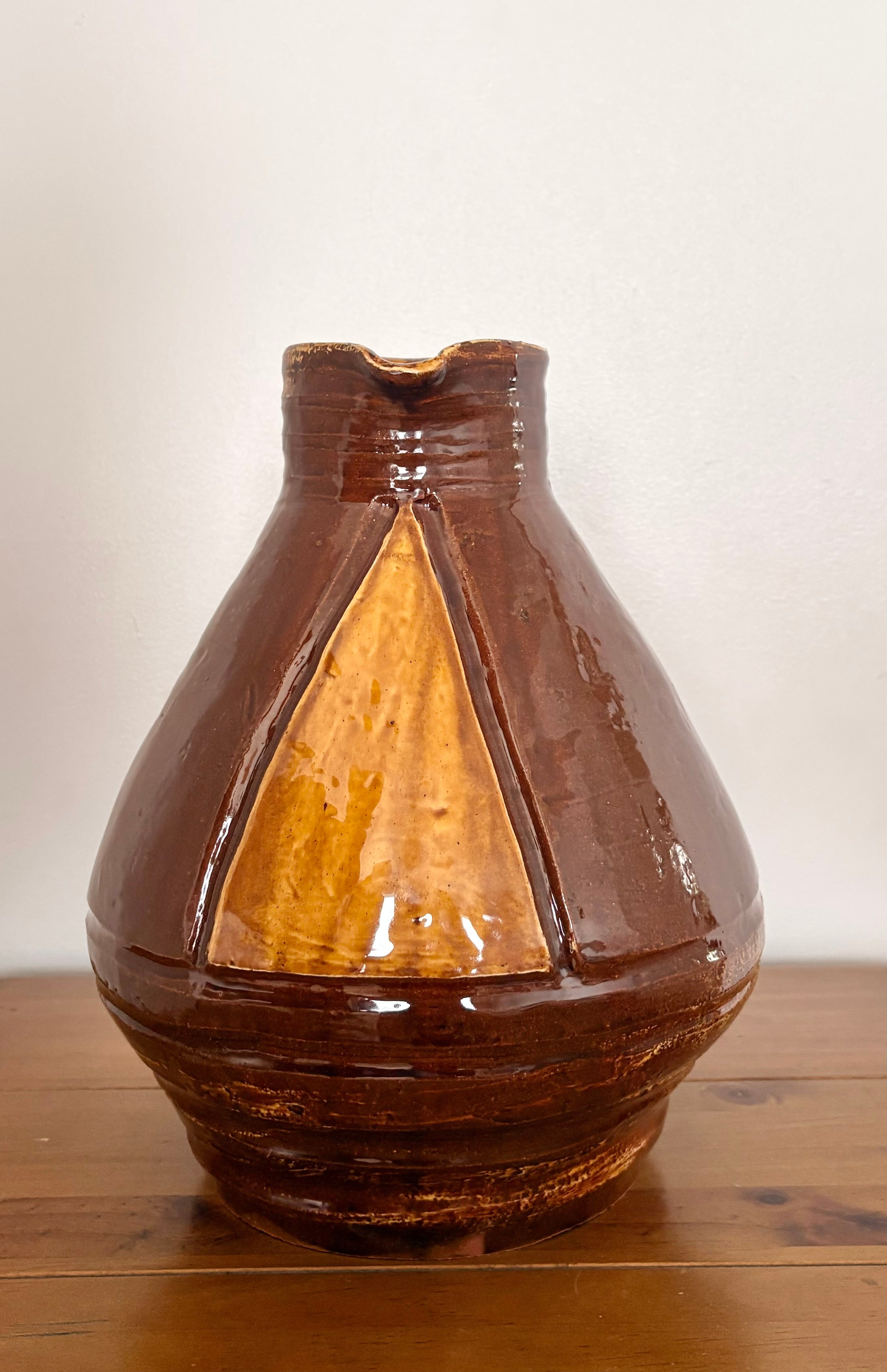 Large earthenware jug with a serpent handle
