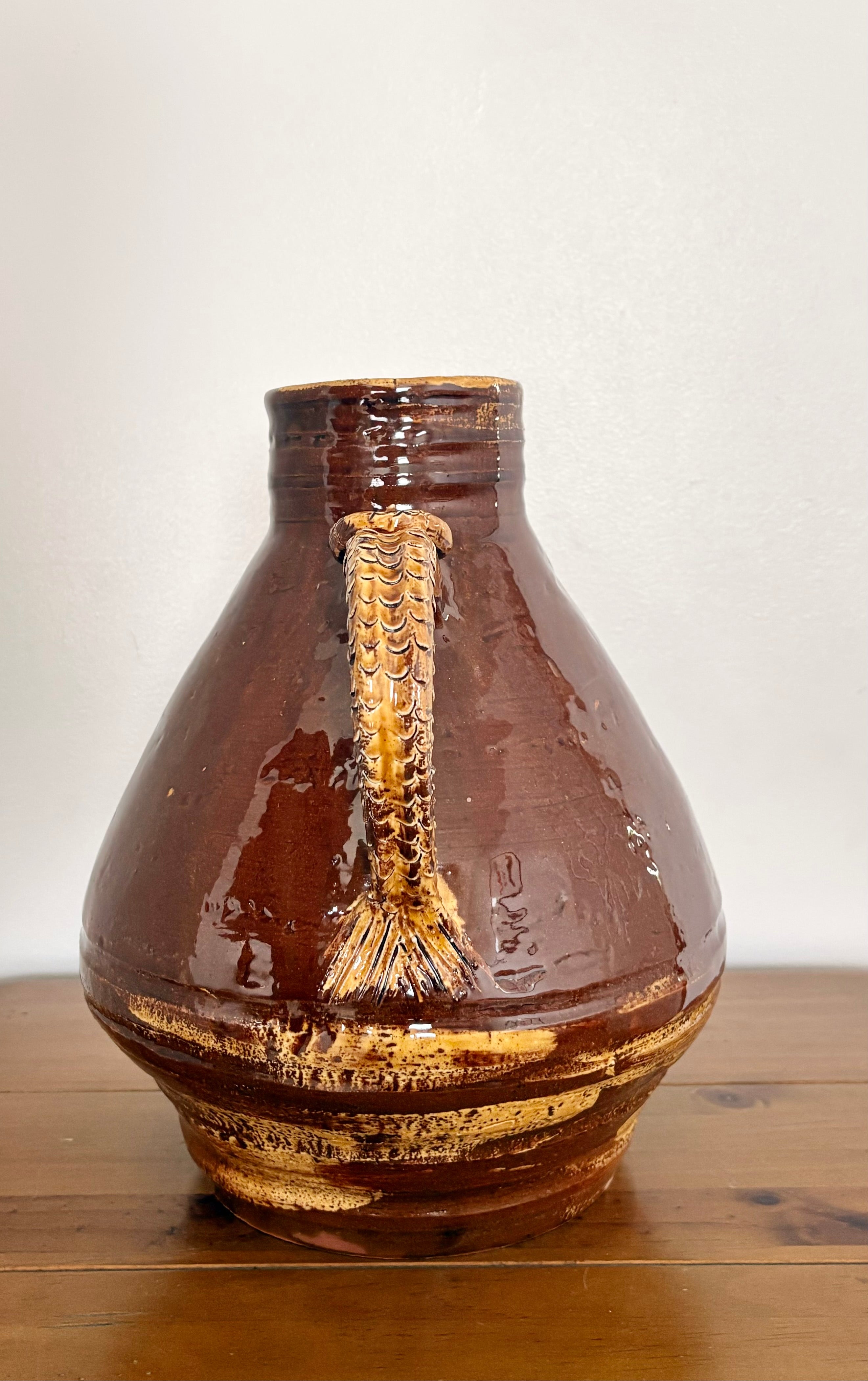 Large earthenware jug with a serpent handle