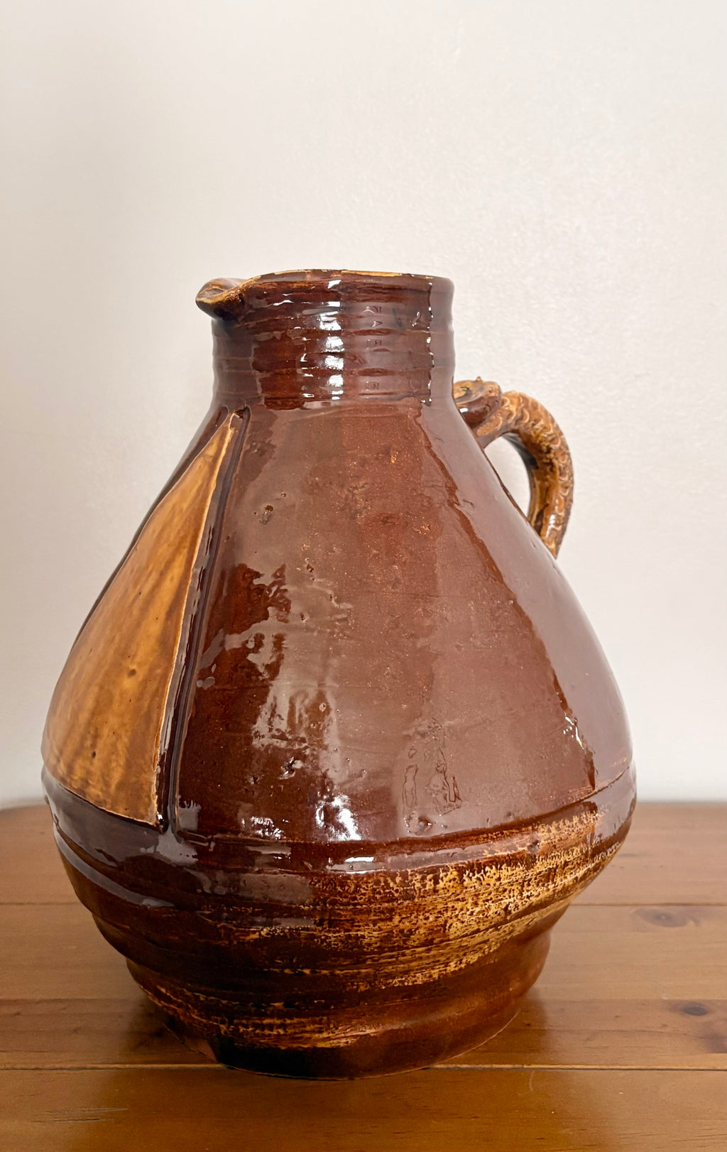 Large earthenware jug with a serpent handle