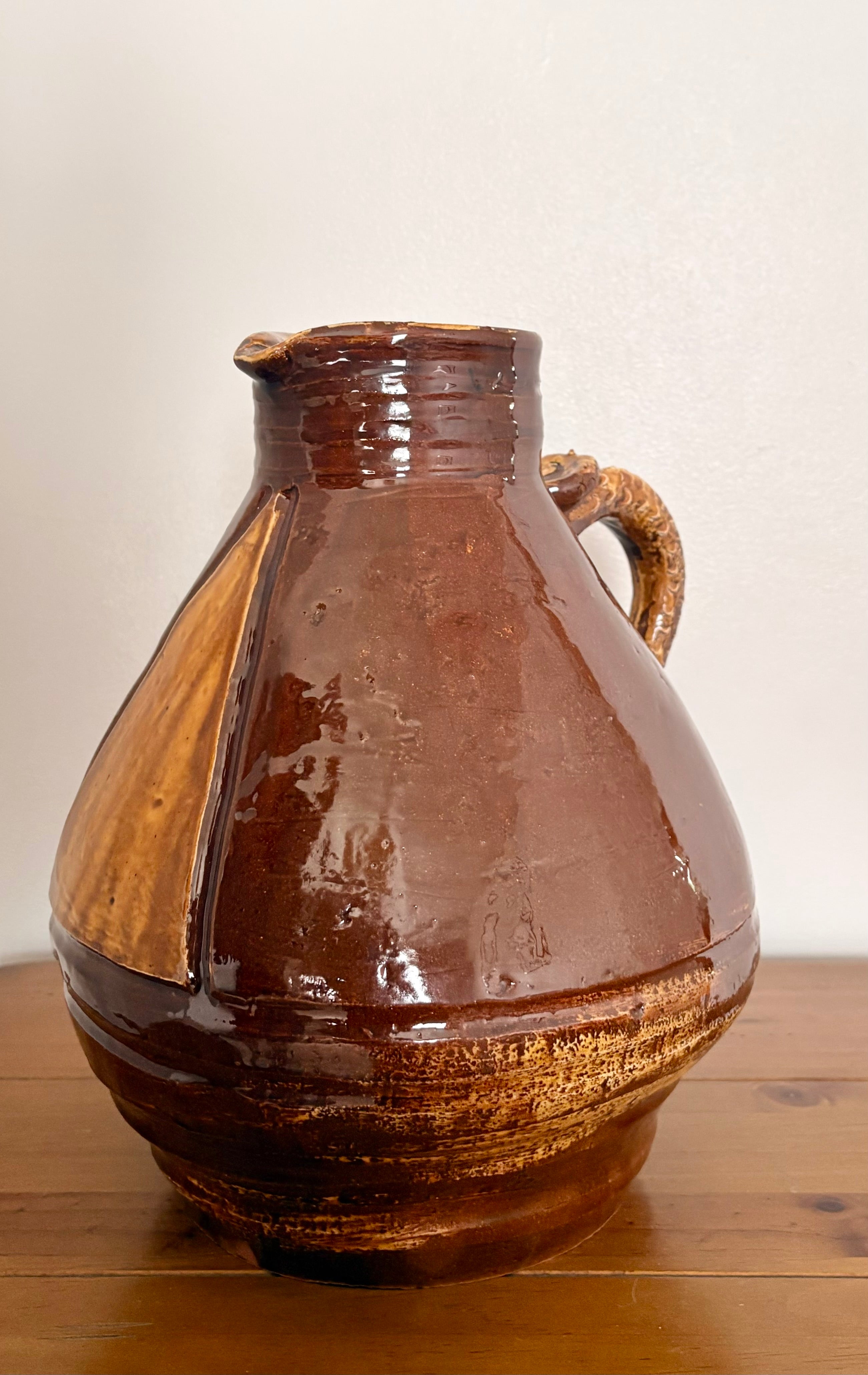 Large earthenware jug with a serpent handle