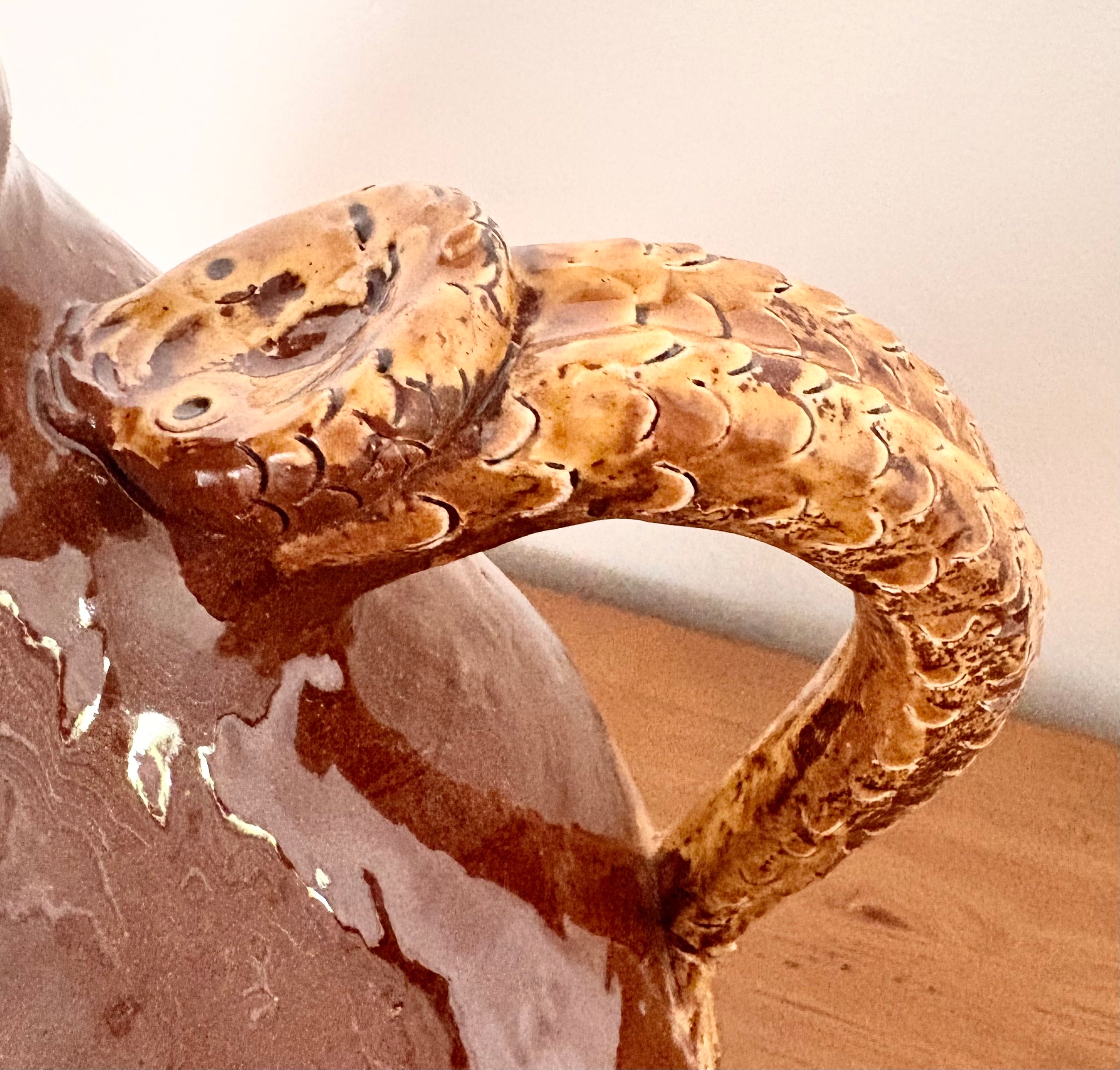 Large earthenware jug with a serpent handle